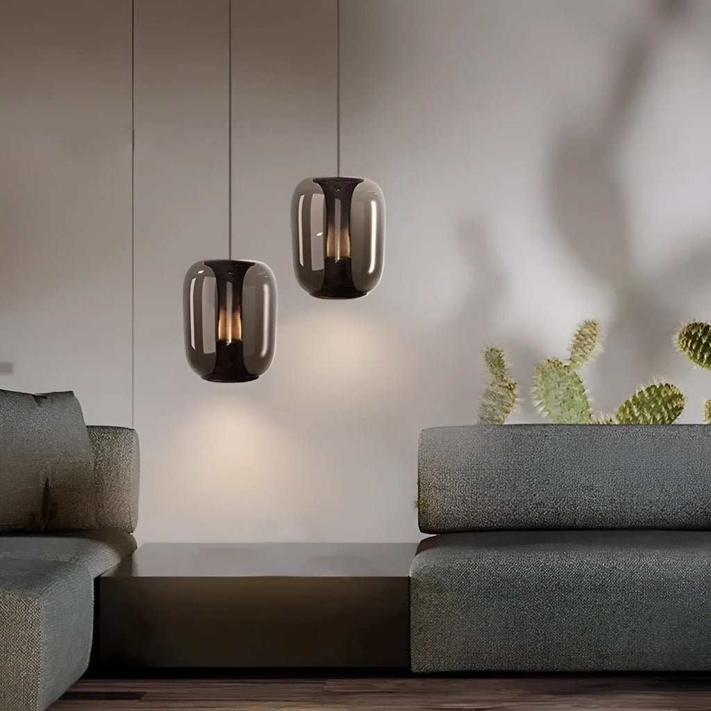 Minimalist Nordic pendant light with a spherical glass globe shade in smoky grey colour.