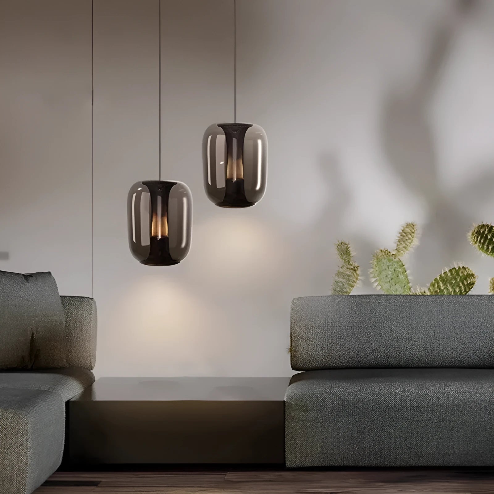 Minimalist Nordic pendant light with a spherical glass globe shade in smoky grey colour.