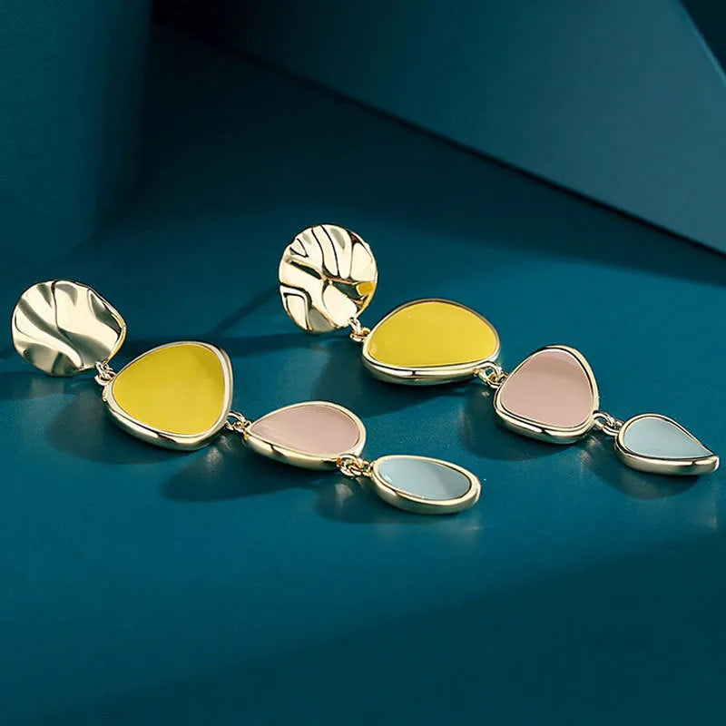 Morandi three-colour oil drip finish on disc-shaped alloy earrings with sterling silver post.