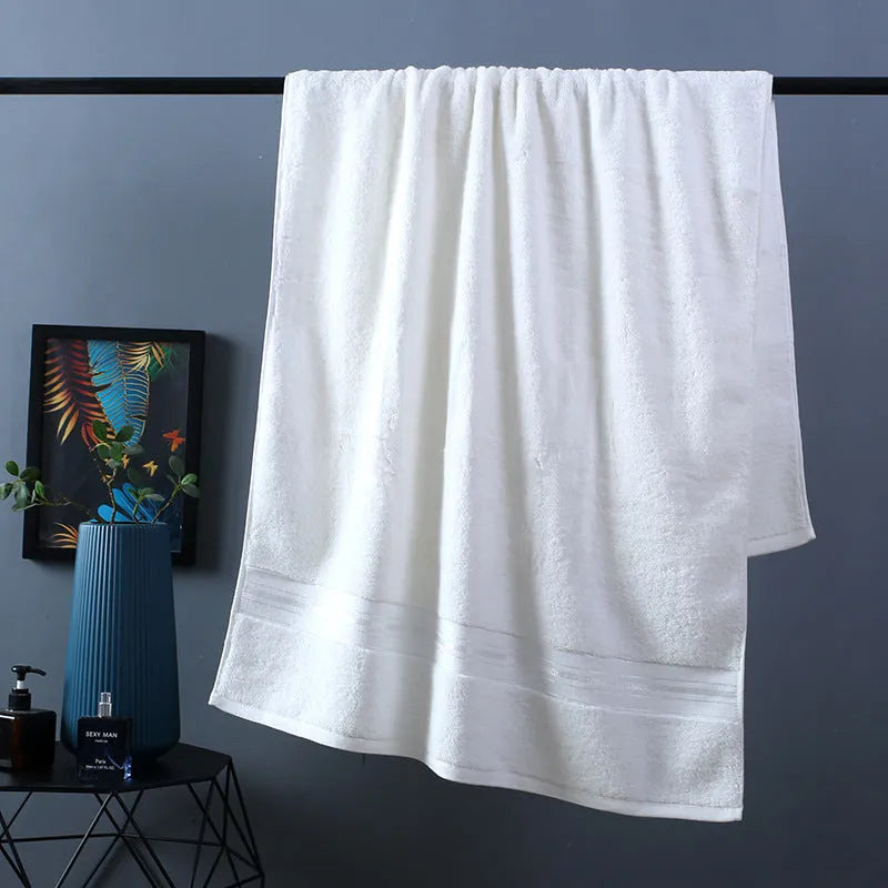 Three-piece thick cotton towel set showing bath towel, hand towel, and square scarf in a solid blue colour.