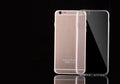 Transparent TPU soft shell protective case for various iPhone models on a table.