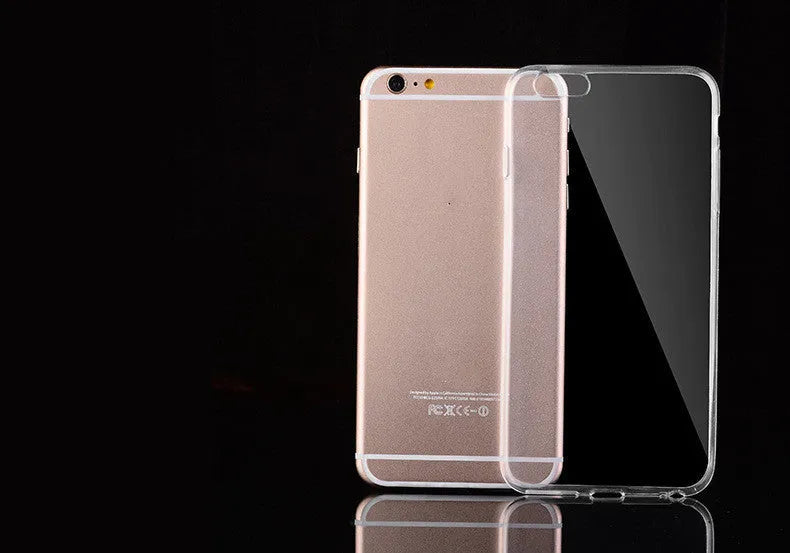 Transparent TPU soft shell protective case for various iPhone models on a table.