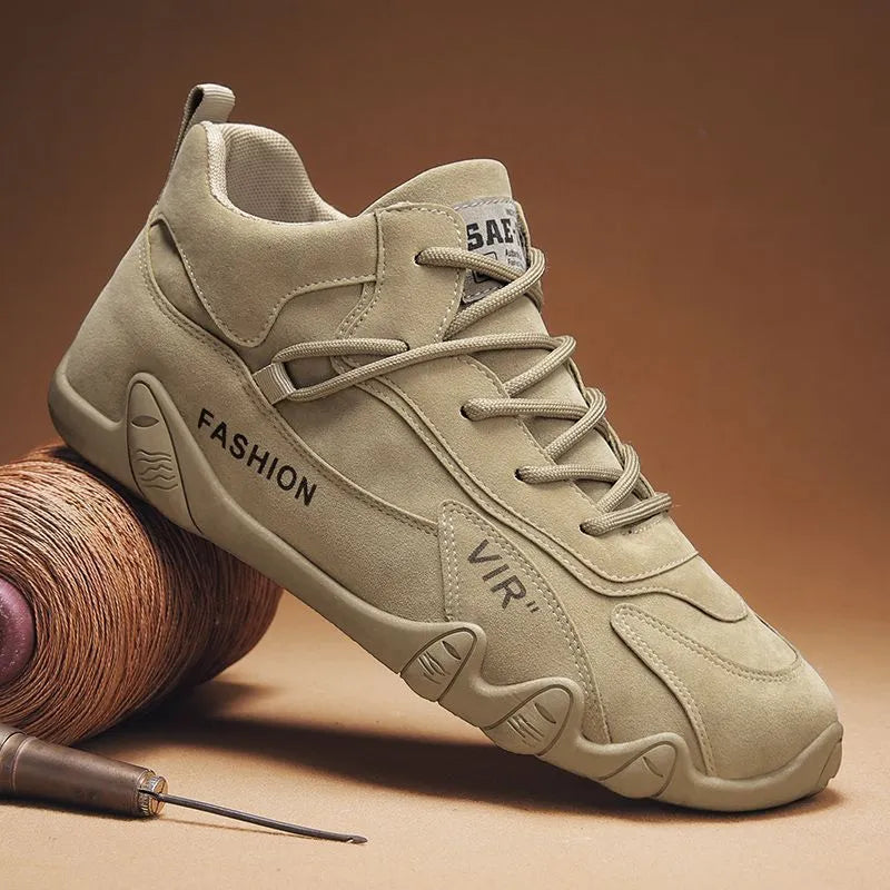 Men's grey low-cut casual work shoes with elastic band and non-slip sole on a plain background.