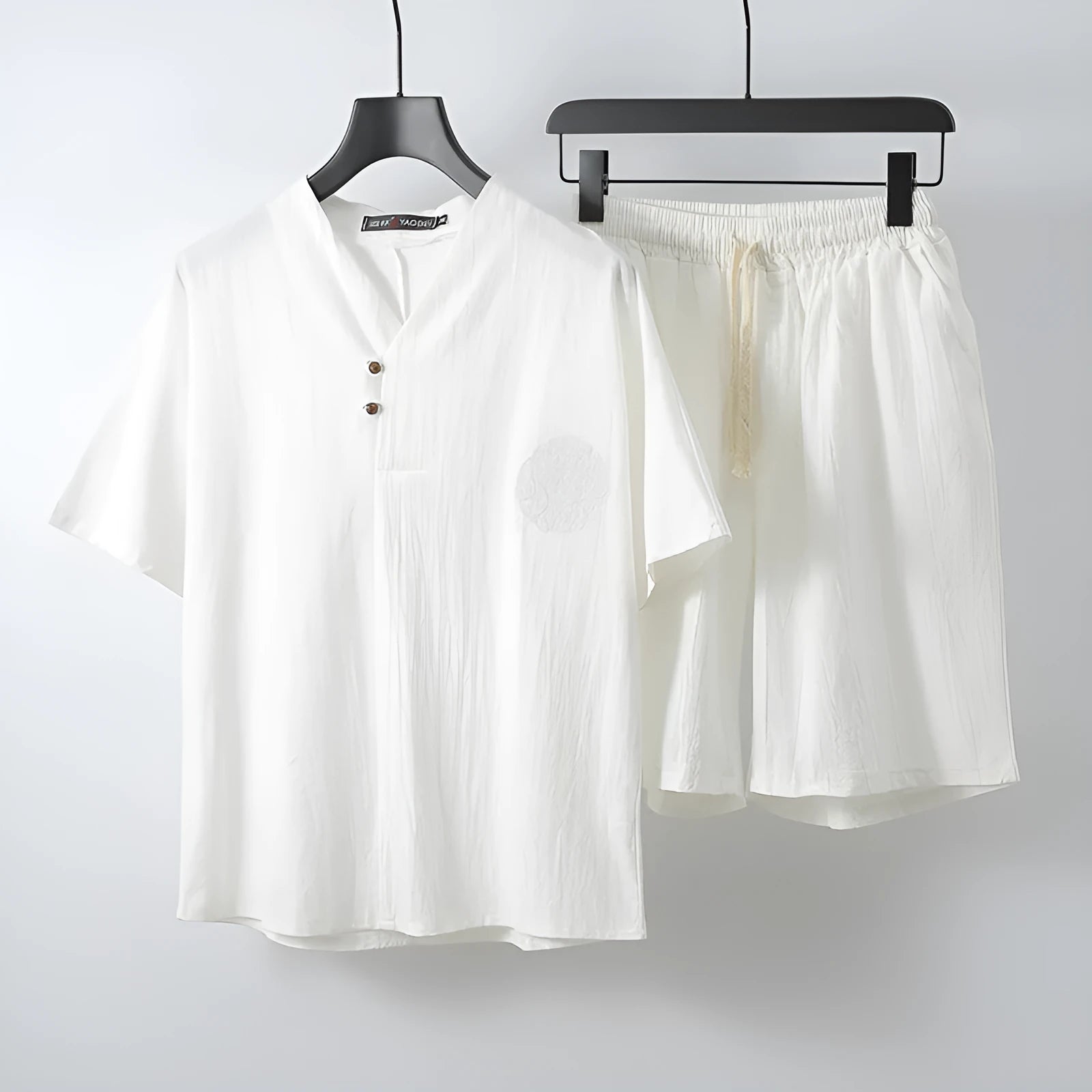 Men's loose linen two-piece set with short-sleeve cotton top and matching linen shorts