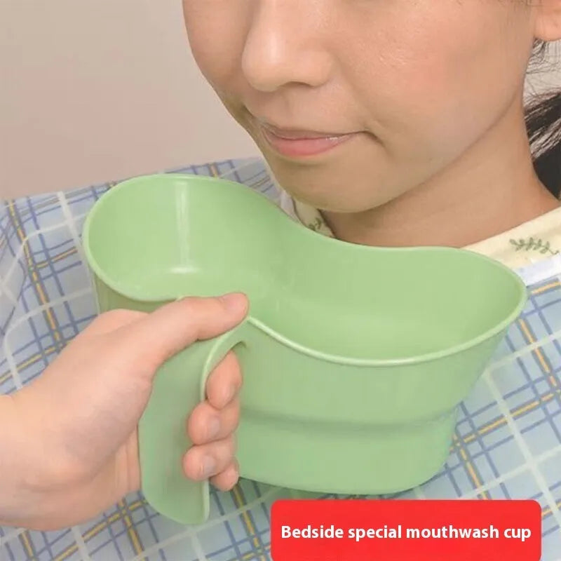 Green plastic gargle cup for bedridden elderly oral care.