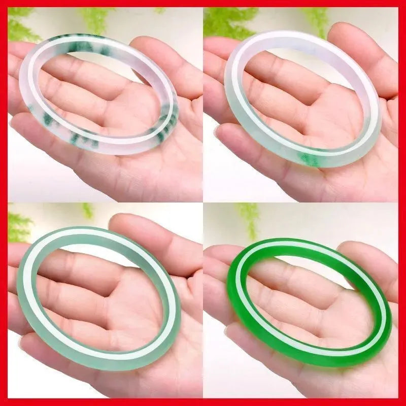 Jade bracelet with floating flower design and auspicious cloud patterns in ice-like emerald appearance