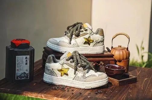 Green low top casual shoes with star pattern, rubber sole, and lace-up closure.