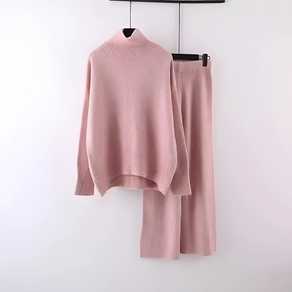 Women's beige acrylic sweater and wide-leg trousers two-piece set laid flat.