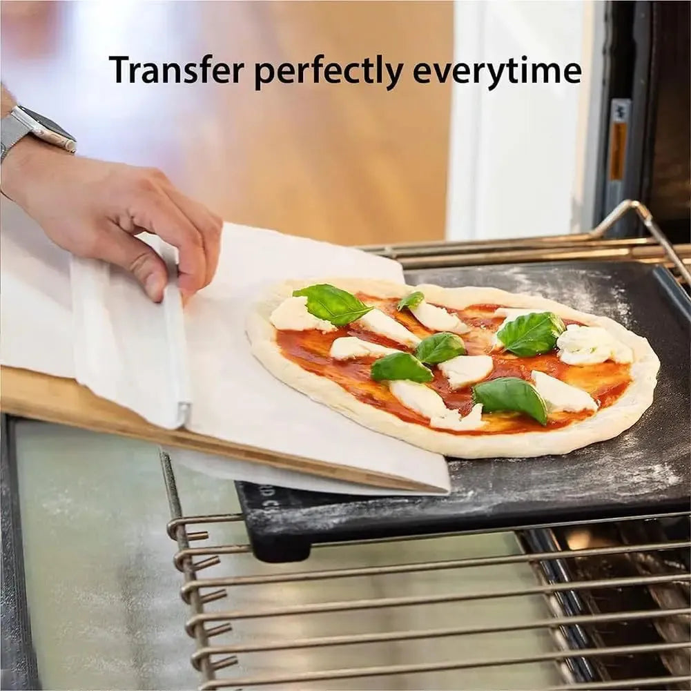Wooden pizza shovel with cutting board surface and hanging hole at handle