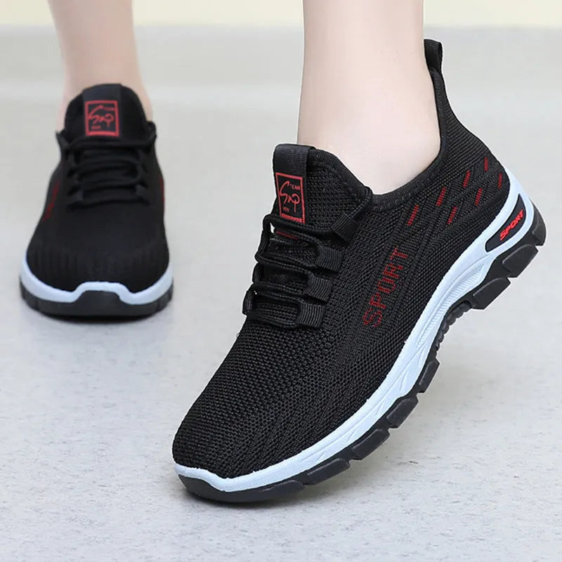 Casual low-top sneaker with soft PVC sole in men's black and women's light purple colour options.