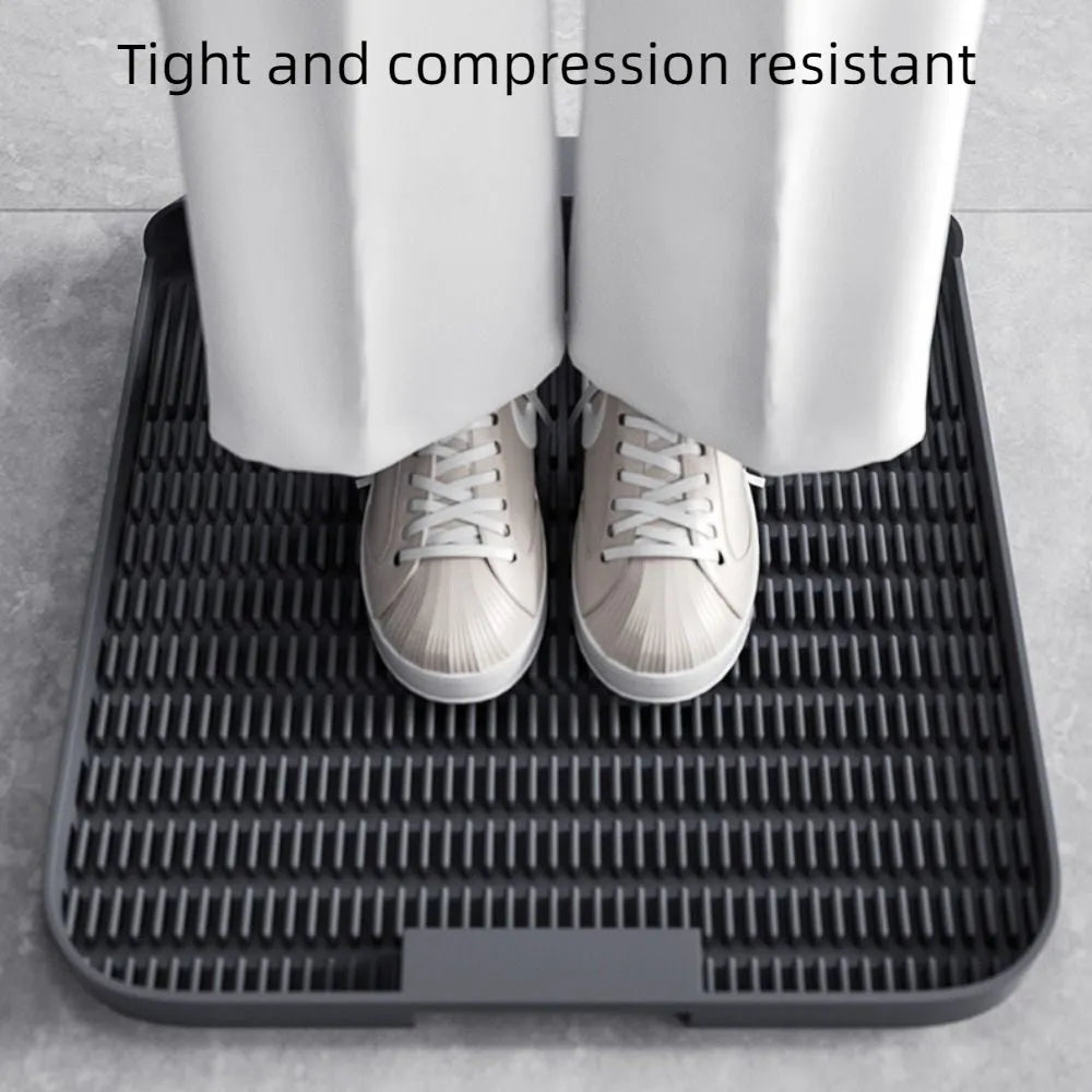 Black cat litter pedal with slanted design and textured grooves for litter containment