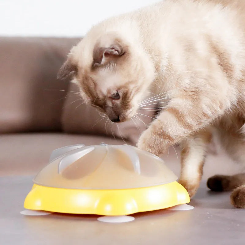 Yellow plastic cat entertainment plate with snack storage compartments and dispensing channels