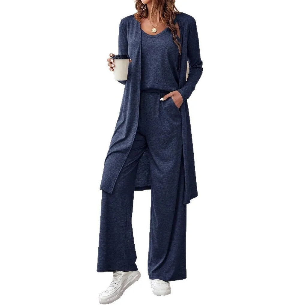 Blue women's casual two-piece suit with top, trousers, and black suspenders laid flat.
