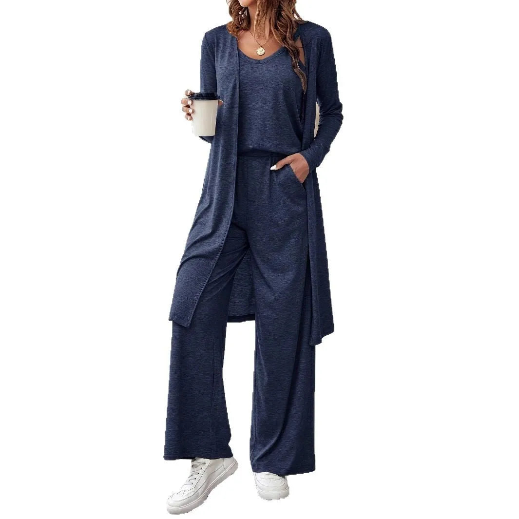 Blue women's casual two-piece suit with top, trousers, and black suspenders laid flat.