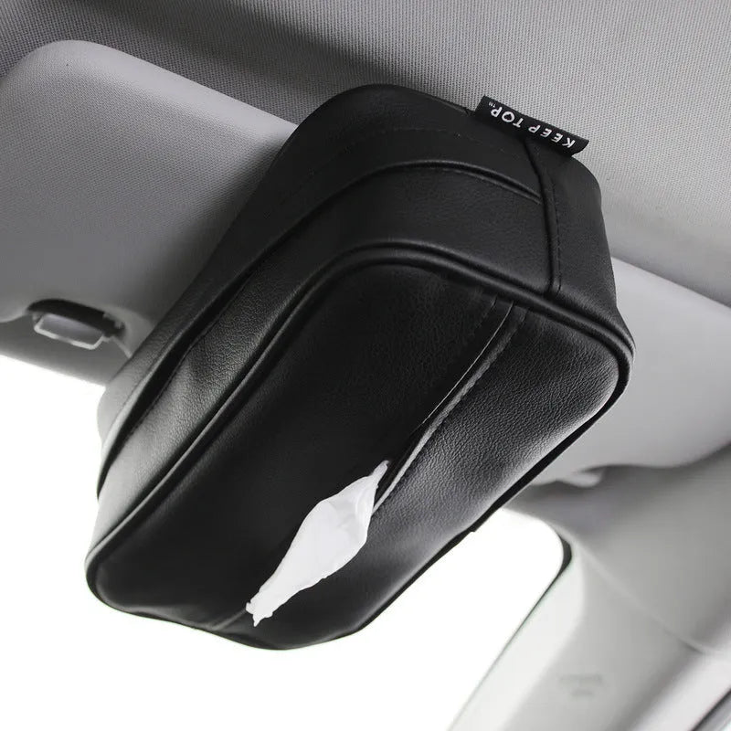Black leather hanging storage box with strap handles for car and home organisation