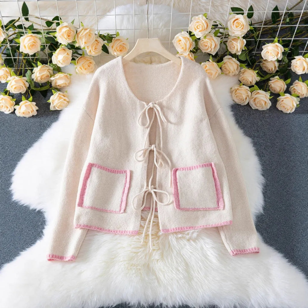 Women's beige loose knitted cardigan with contrast colour, front lace-up fastening and pocket, sizes S to XL