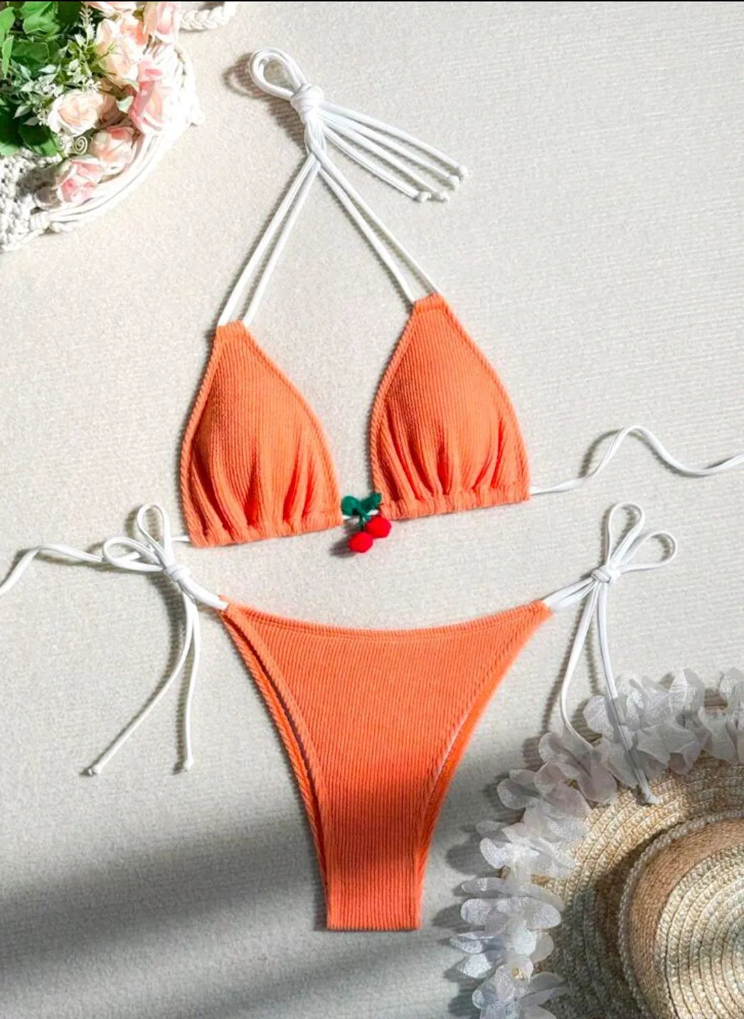 Women's bikini swimsuit set in a briefs style, shown in one of five solid colours: apricot, matcha, orange, pink, or white.