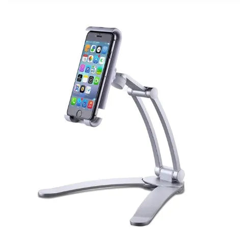 Silver aluminium alloy desktop tablet stand with adjustable clips and 360-degree rotation on a white mount.