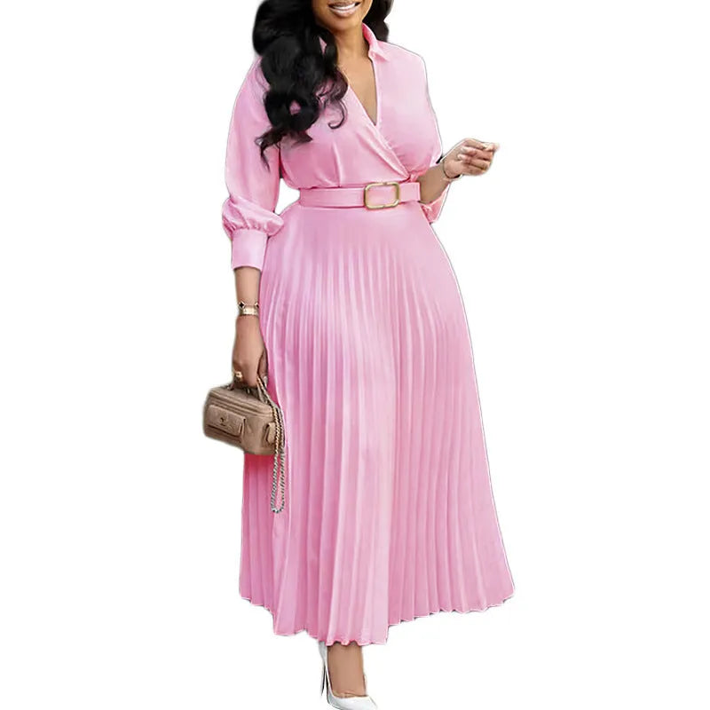 Women's mid-length pleated dress with polo collar and three-quarter sleeves in a solid colour with a belt.