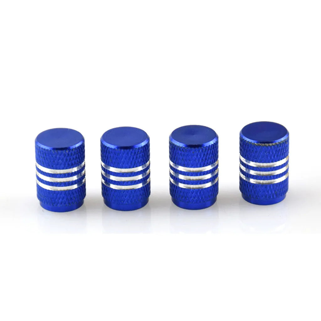 Set of aluminium alloy tyre valve caps in various metallic colours including red, blue, black, gold and silver.