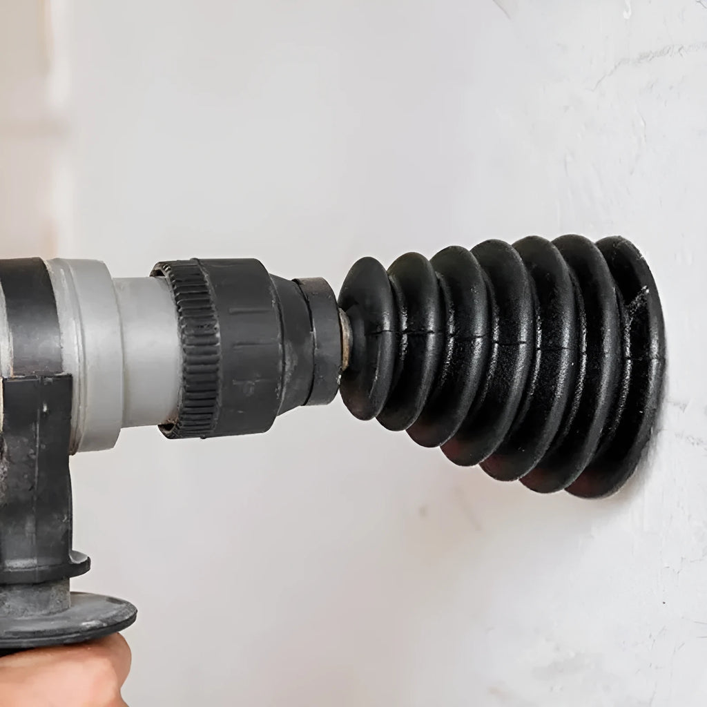Black rubber electric hammer dust cover on rotary hammer tool head, side view