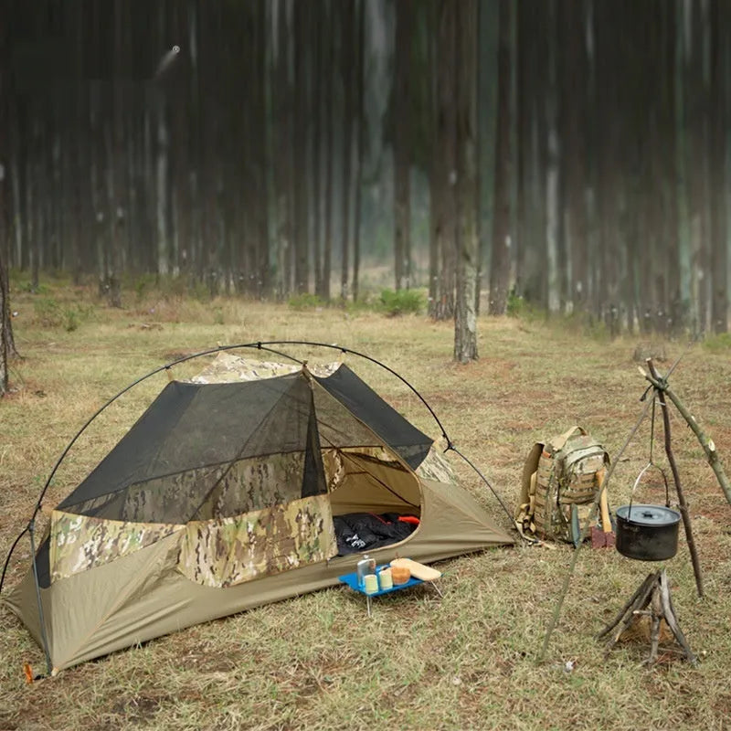 Single soldier camouflage tent shown in outdoor setting with rainproof and sun protection features for camping use