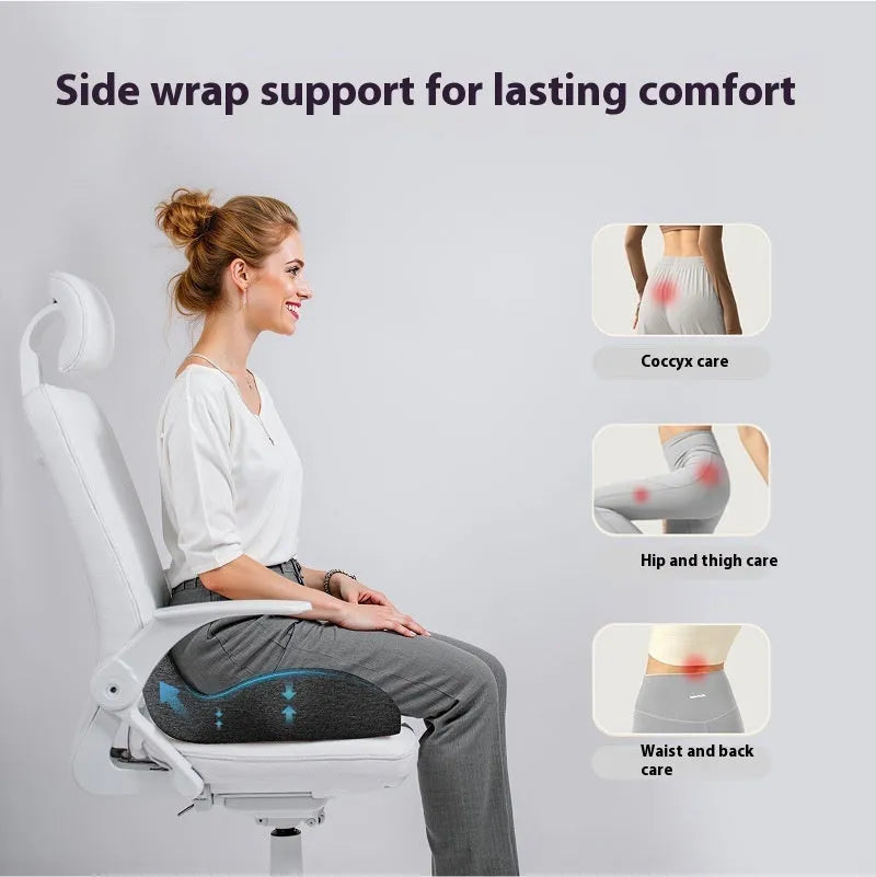Solid-colour memory foam office chair cushion in light grey, shown on a chair.
