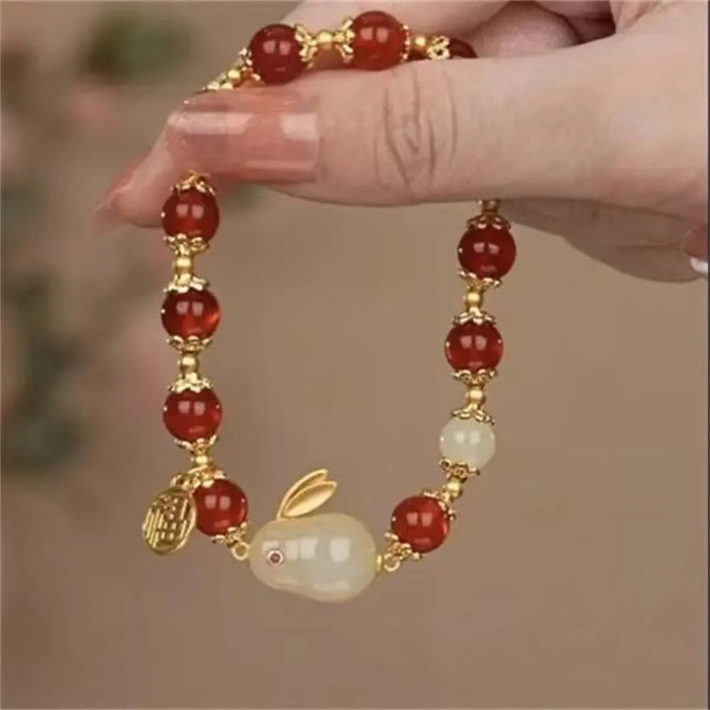 Handcrafted glass and coloured glaze bracelet with rabbit charm in national style design