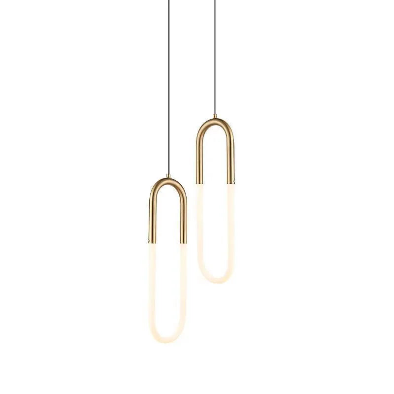 Modern Nordic-style U-shaped pendant chandelier light in a bedroom setting, showing compact 200mm design.