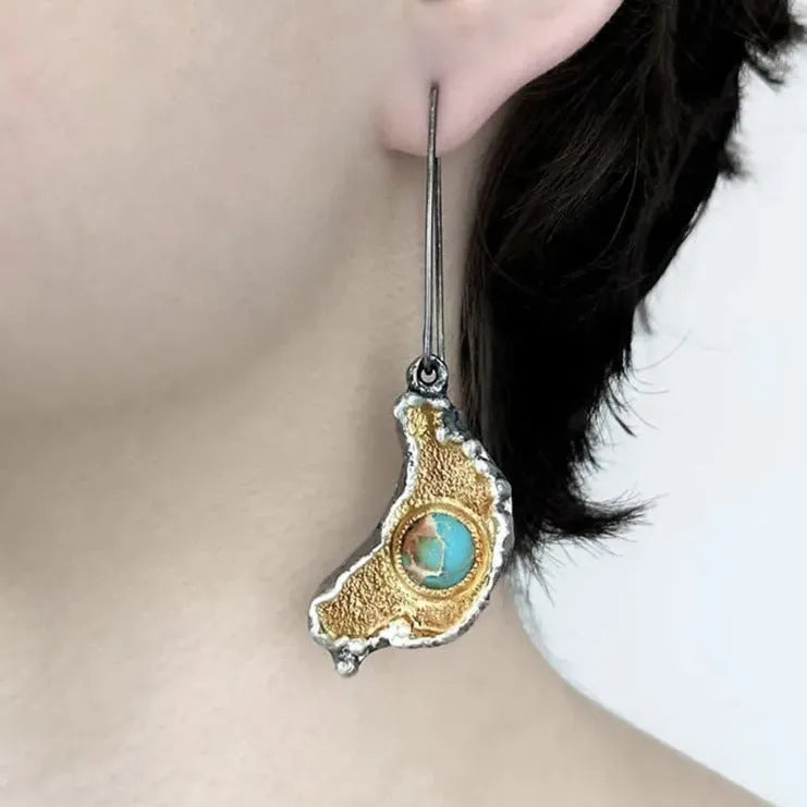 Ear-shaped women's earrings in alloy with a two-tone oil-painted geometric finish, shown as a pair