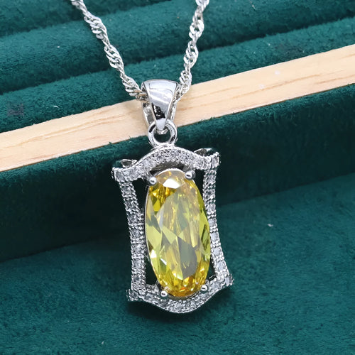 Yellow anti-allergy zircon jewellery set with snake bone chain necklace, earrings, ring, and bracelet on display.