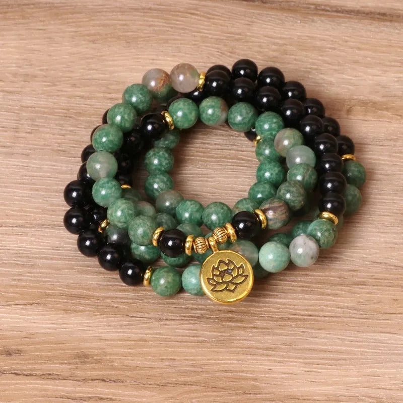 Green and black elastic beaded long bracelet with alloy construction
