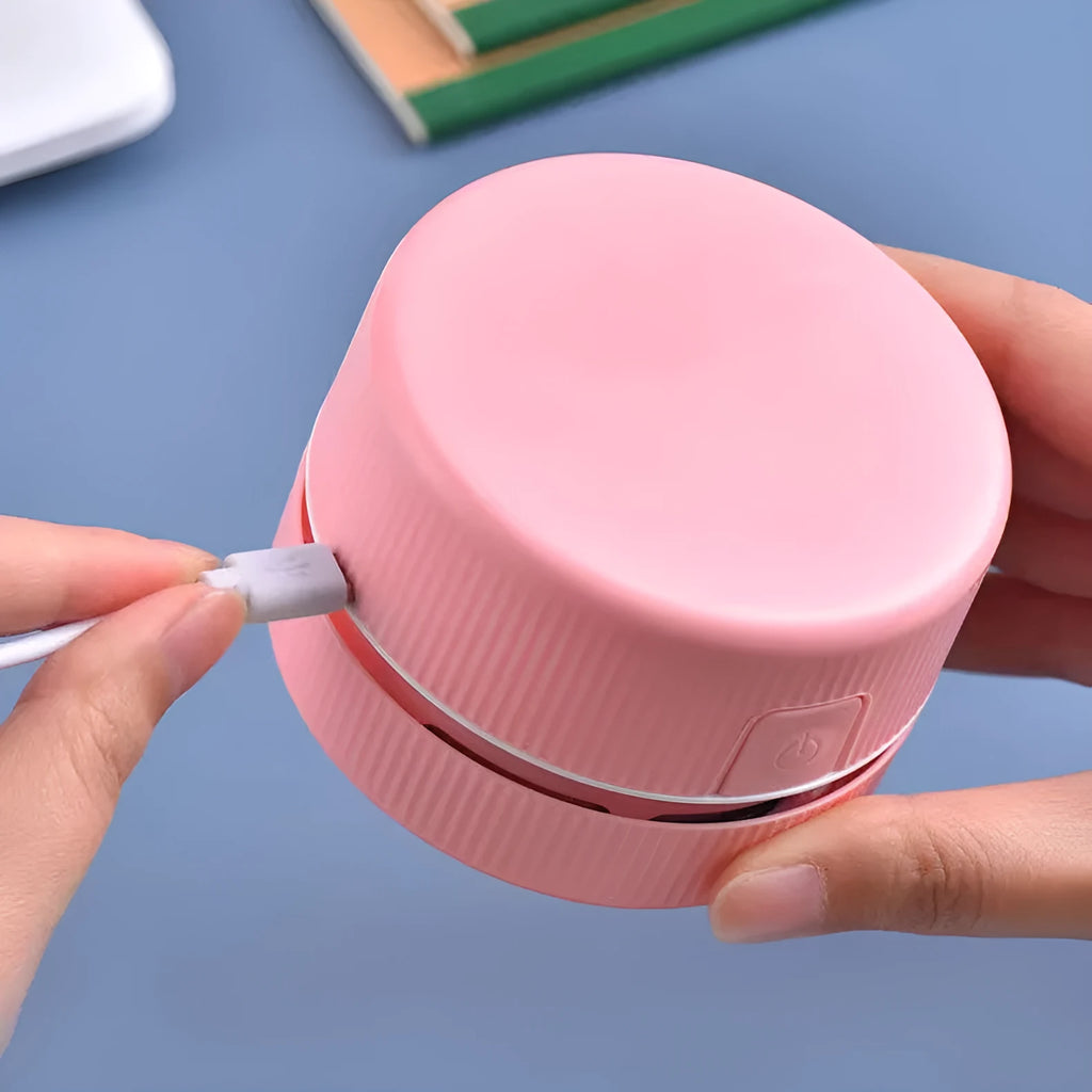 Pink and blue mini handheld desktop vacuum cleaner for pencil shavings and fine debris