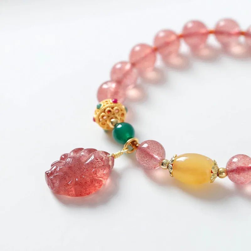 Women's crystal bracelet with polished strawberry quartz beads in nine tail fox colour design