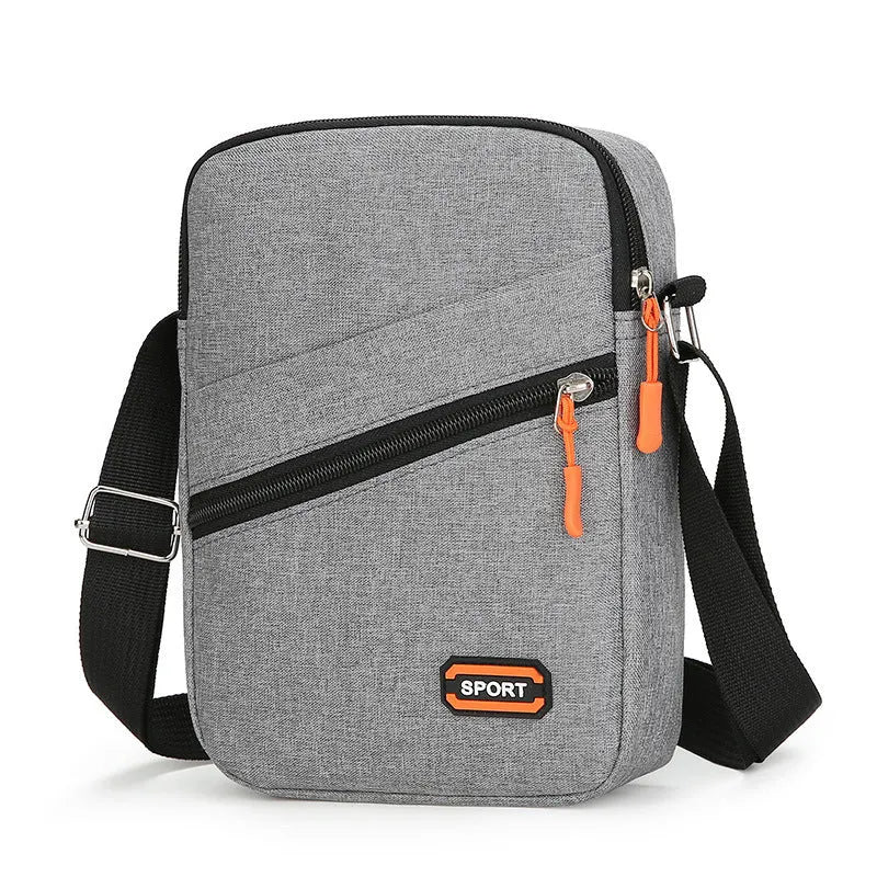 Oxford cloth commuter bag in silver grey, black, or navy blue with crossbody shoulder strap and contrast colour detailing
