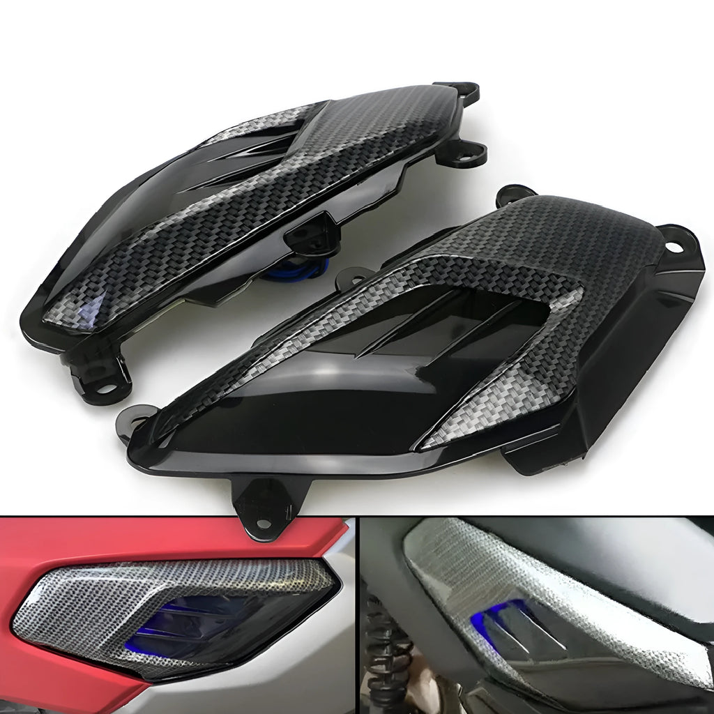 Pair of YAMAHA NMAX side replacement lamps with LED lights and carbon fibre pattern, showing blue illumination option.