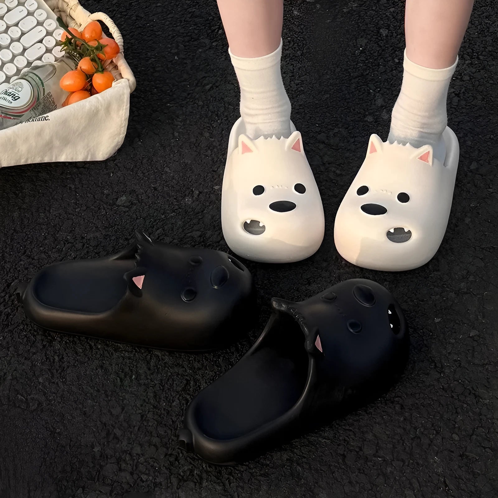 Women's black EVA slipper sandals with puppy toe cap design showing injection-moulded sole