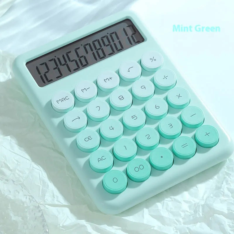 Gradient colour desk calculator in violet, pink, blue, or mint green on a desk.