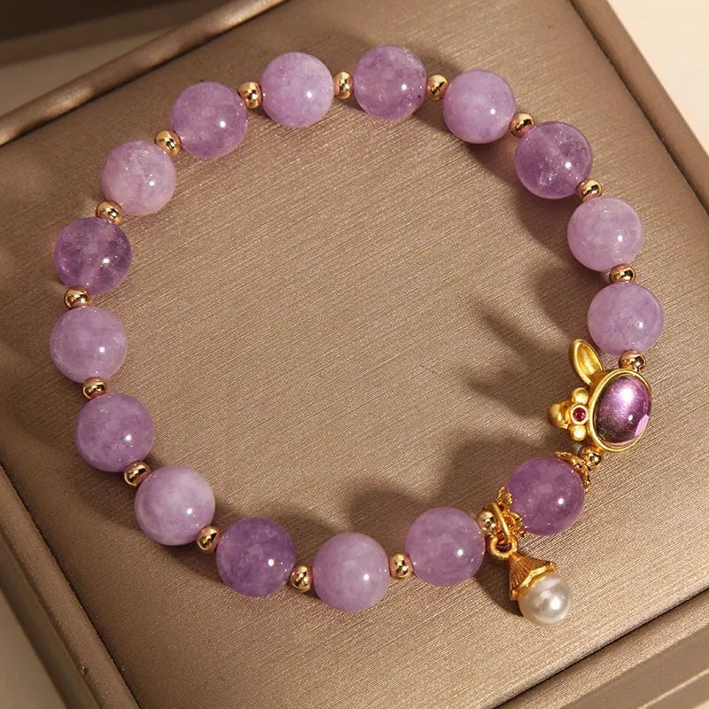 Mauve jade hare head pendant on a clear crystal bracelet, Mori style design.