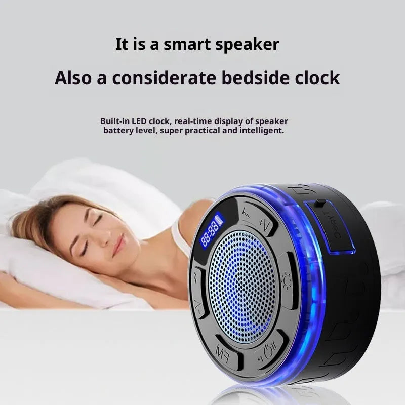 Waterproof Bluetooth speaker with large suction cup in black, mounted on bathroom tile