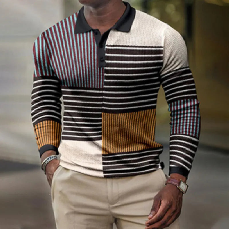 Man wearing a grey 3D printed striped long-sleeved casual top made from polyester fabric.