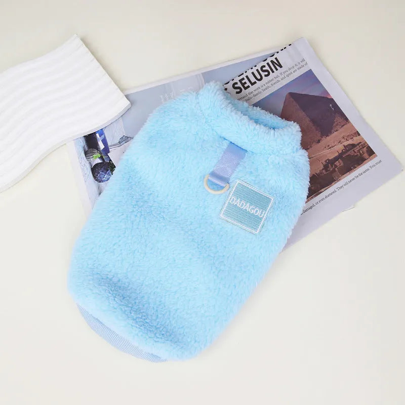A blue coral fleece jacket for a dog or cat with a pull ring fastening, shown in size M.