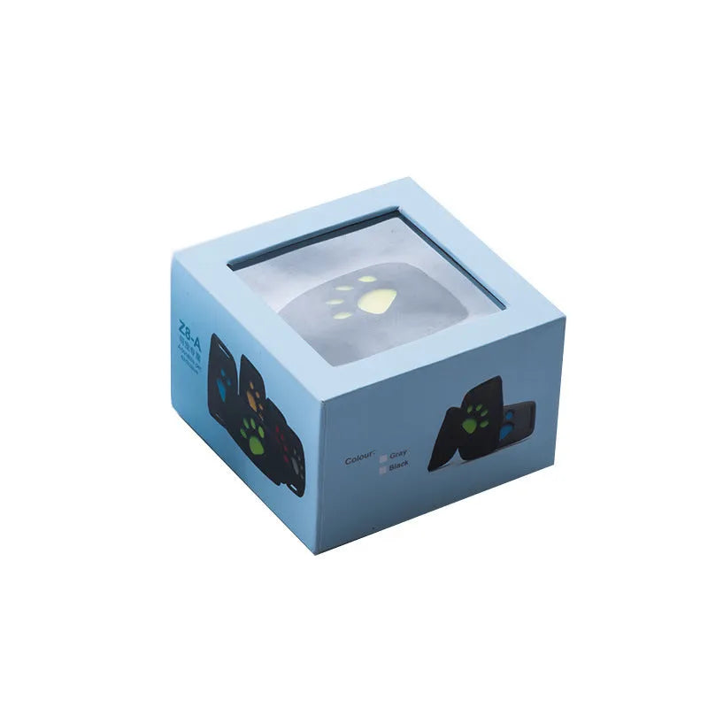 Waterproof GPS pet tracker in black casing with yellow interior showing compact dimensions for collar attachment