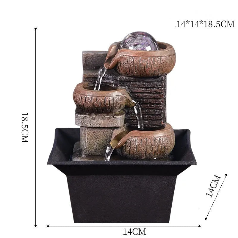 European desktop fountain with crystal ball and flowing water on a wooden desk