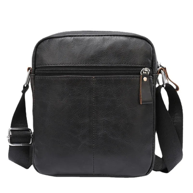 Brown genuine leather messenger bag with crossbody strap showing sewing-line detailing