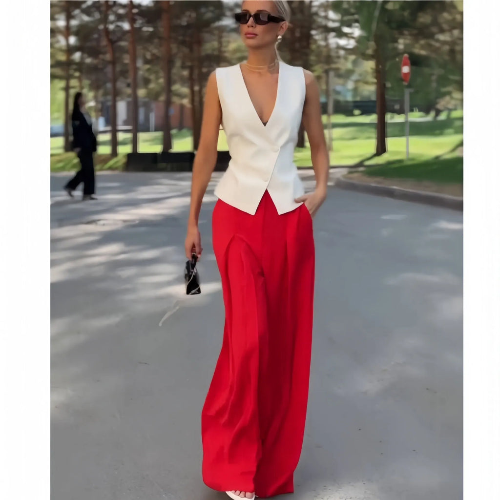 Women's beige two-piece set with sleeveless deep V-neck top and high-waisted wide-leg trousers