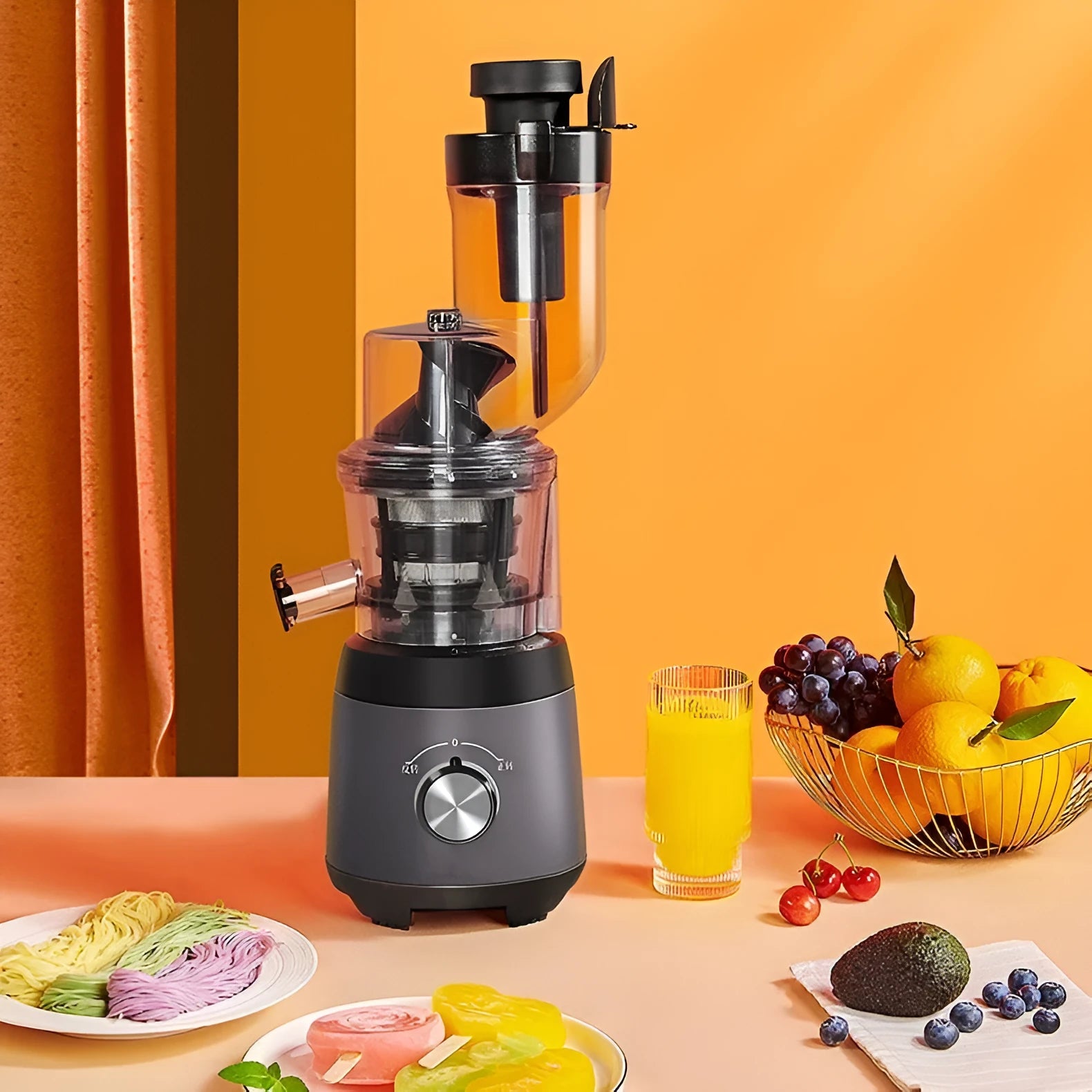 Grey slow masticating juicer with 90mm feed chute and multi-function separator on countertop
