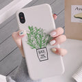White silicone iPhone case with detailed painted plant design on the back