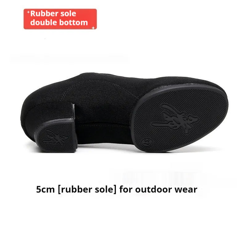 Men's black oxford cloth ballroom dancing shoes with rubber sole and middle heel on a dance floor