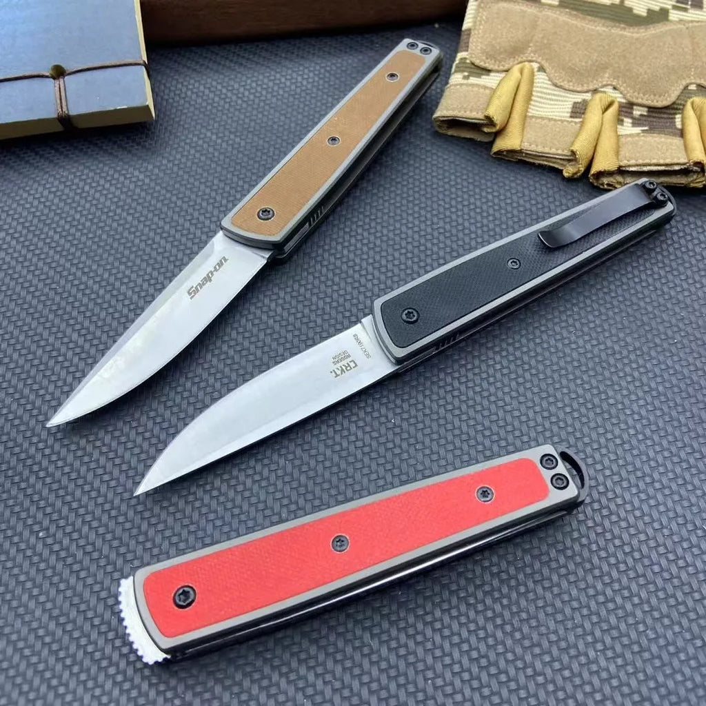 Folding fruit knife with stainless steel blade in black, coffee, or red colour options showing extended and closed positions